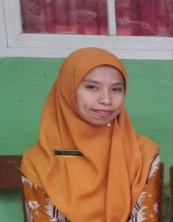 Elvi Yasni, S.Pd.